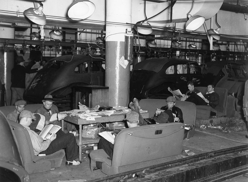 Members of the nascent United Auto Workers Union (UAW) during a sit-down strike in the General Motors Fisher Body Plant in Flint, Michigan in 1937. Photo credit Getty Images